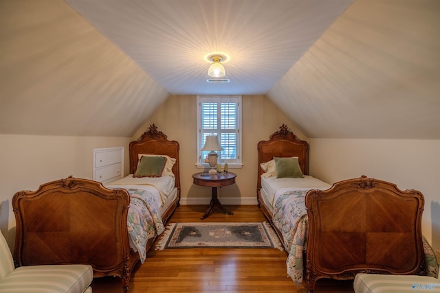 260 Bexar Ave W, Hamilton, AL 35570 - bedroom with baseboards, visible vents, wood finished floors, and lofted ceiling