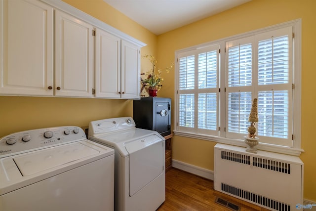 260 Bexar Ave W, Hamilton, AL 35570 - laundry room with wood finished floors, radiator, baseboards, visible vents, and washer and dryer