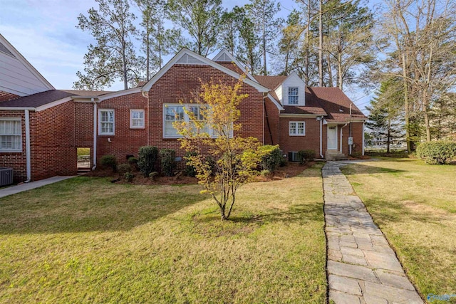 260 Bexar Ave W, Hamilton, AL 35570 - view of front of property with brick siding, central AC unit, and a front lawn