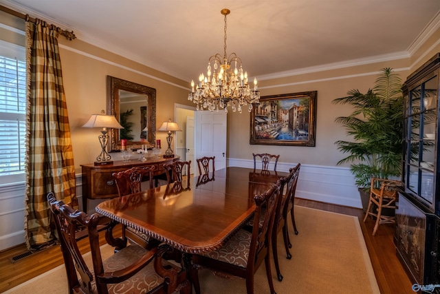 260 Bexar Ave W, Hamilton, AL 35570 - dining space featuring an inviting chandelier, visible vents, ornamental molding, and wood finished floors