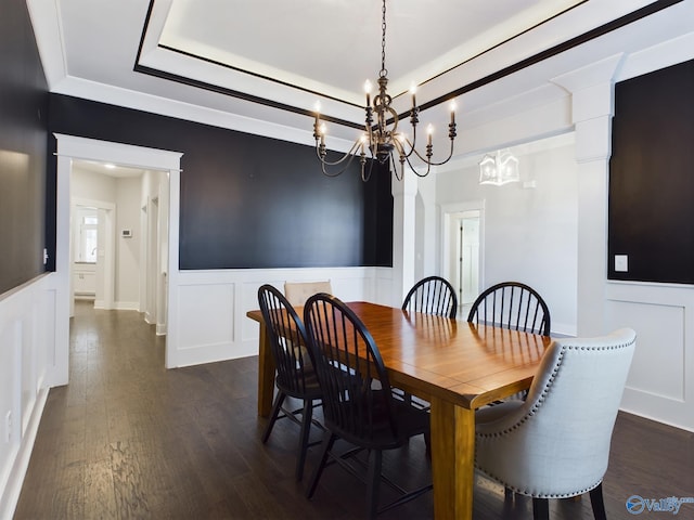 dining room featuring dark wood-type flooring and a chandelier