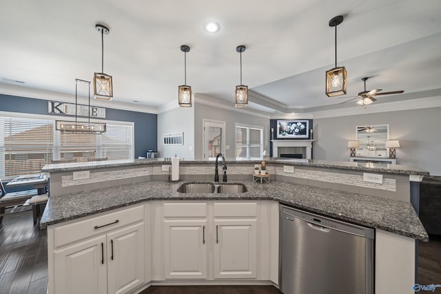kitchen featuring a ceiling fan, a sink, open floor plan, dishwasher, and dark wood-type flooring