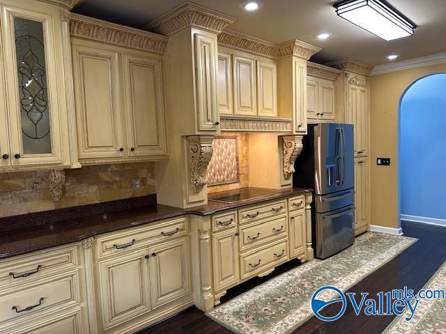 752 12th Way NE, Arab, AL 35016 - kitchen with dark wood finished floors, cream cabinetry, and stainless steel refrigerator with ice dispenser