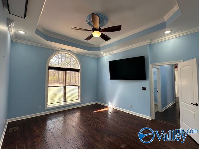 752 12th Way NE, Arab, AL 35016 - interior space with a ceiling fan, wood finished floors, a raised ceiling, baseboards, and ornamental molding