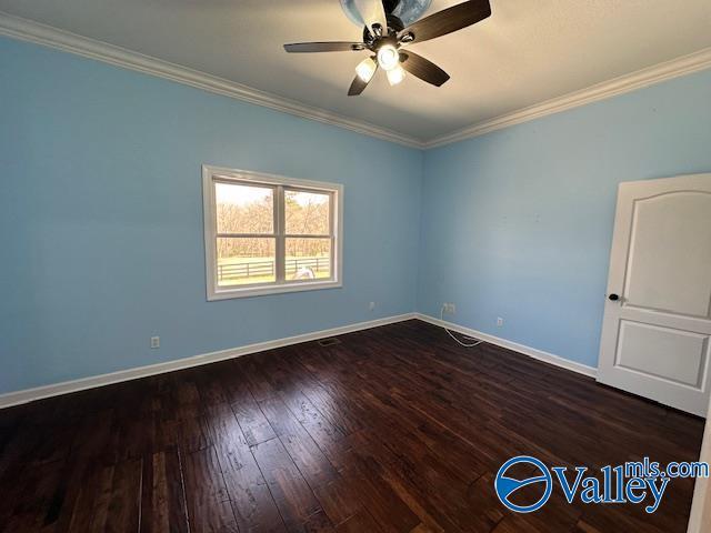 752 12th Way NE, Arab, AL 35016 - unfurnished room with dark wood finished floors, a ceiling fan, baseboards, and ornamental molding