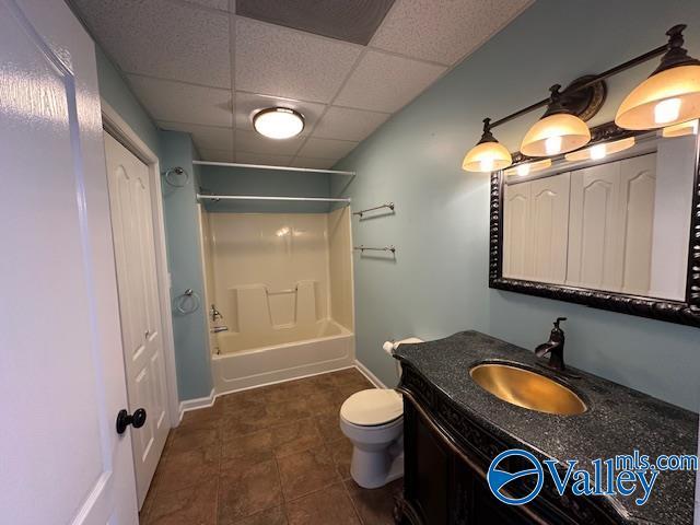 752 12th Way NE, Arab, AL 35016 - bathroom featuring tile patterned floors, vanity, toilet, a paneled ceiling, and bathing tub / shower combination