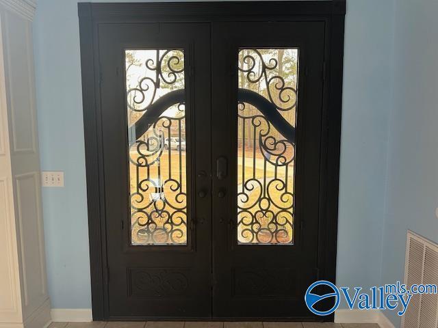752 12th Way NE, Arab, AL 35016 - room details featuring a gate, visible vents, baseboards, and french doors