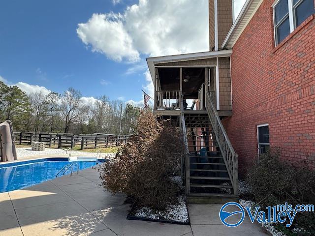 752 12th Way NE, Arab, AL 35016 - view of swimming pool with stairway, fence, a patio, and a fenced in pool