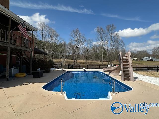 752 12th Way NE, Arab, AL 35016 - view of pool featuring a water slide, fence, a patio area, and a fenced in pool