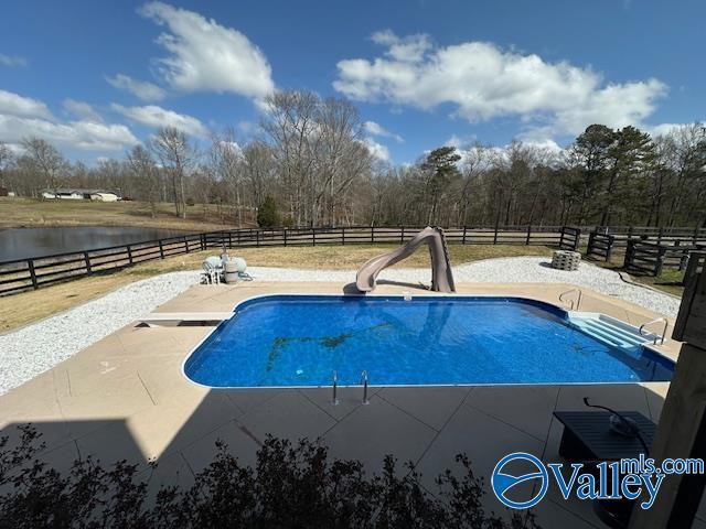 752 12th Way NE, Arab, AL 35016 - view of swimming pool with a patio area, a fenced backyard, a diving board, a fenced in pool, and a water slide