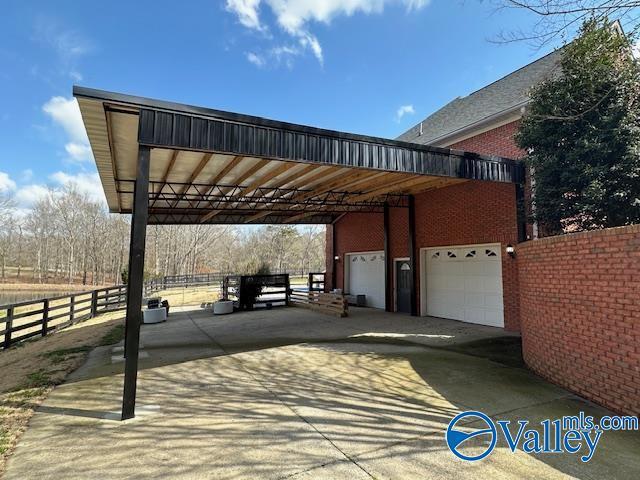 752 12th Way NE, Arab, AL 35016 - exterior space with concrete driveway and fence