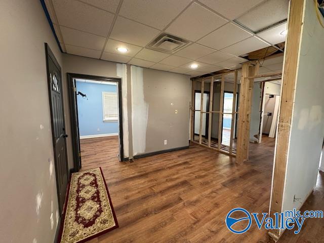 752 12th Way NE, Arab, AL 35016 - spare room with wood finished floors, plenty of natural light, baseboards, visible vents, and a paneled ceiling
