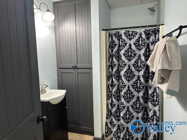 752 12th Way NE, Arab, AL 35016 - bathroom with tile patterned flooring, vanity, and curtained shower
