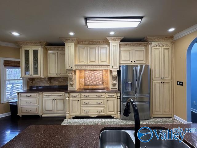 752 12th Way NE, Arab, AL 35016 - kitchen with ornamental molding, cream cabinets, and stainless steel fridge with ice dispenser