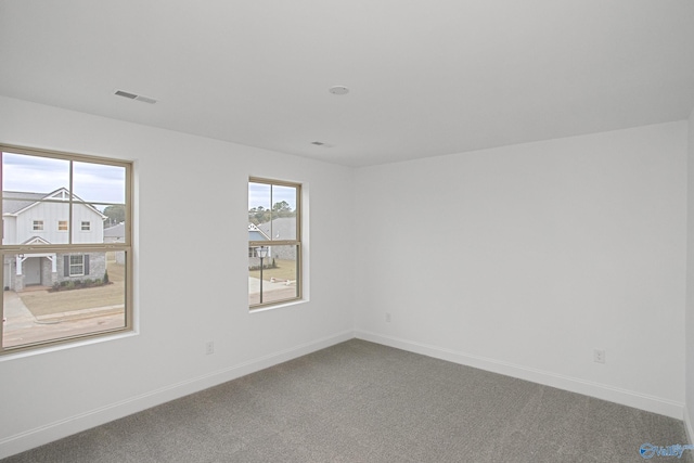 unfurnished room featuring carpet floors