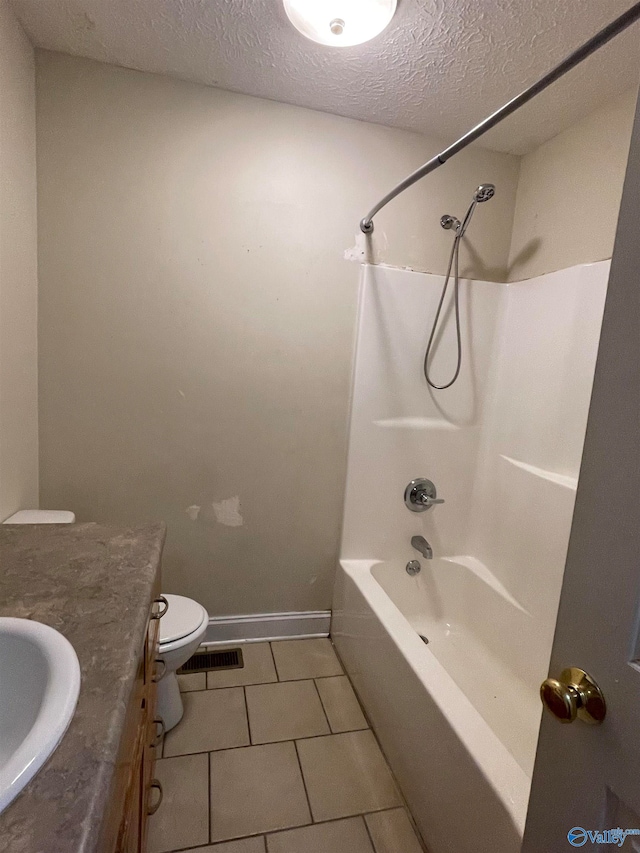 full bathroom featuring shower / bathtub combination, vanity, a textured ceiling, tile patterned flooring, and toilet