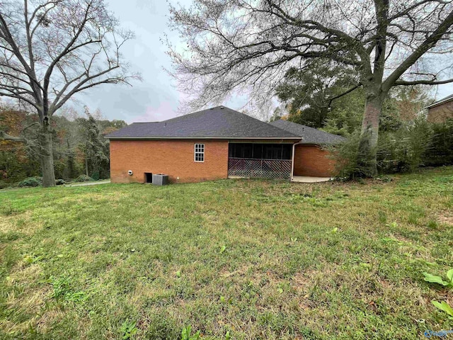 rear view of property with a yard