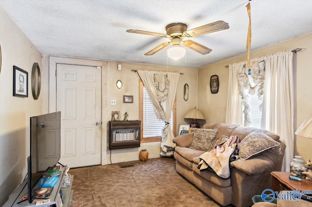 living room with carpet, a textured ceiling, and ceiling fan