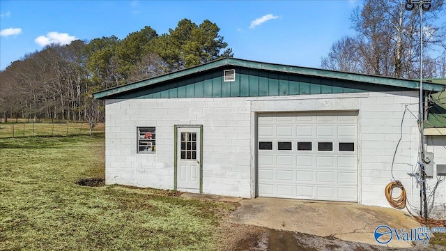 garage with a lawn