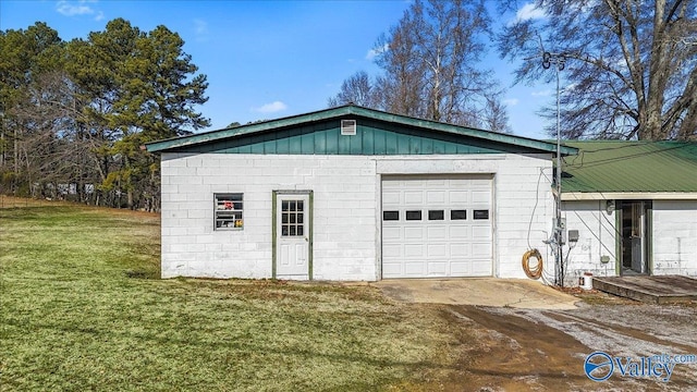 garage featuring a lawn