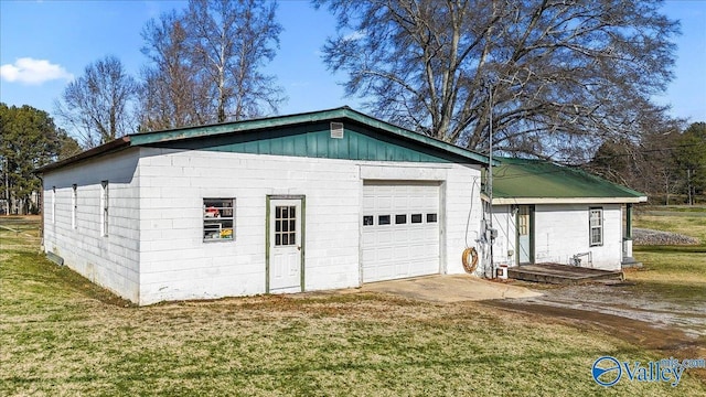 garage featuring a yard