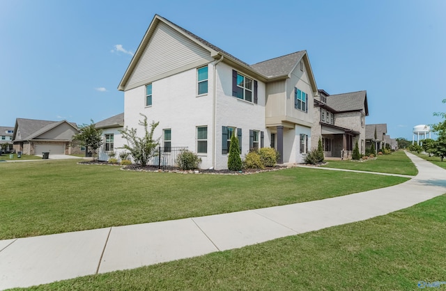 view of front of home with a front yard and a garage