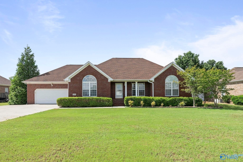 24886 Queen Annes Lace, Athens, AL 35613 - ranch-style home featuring a front lawn, brick siding, driveway, and an attached garage
