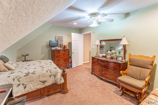 bedroom with light carpet, a textured ceiling, and ceiling fan