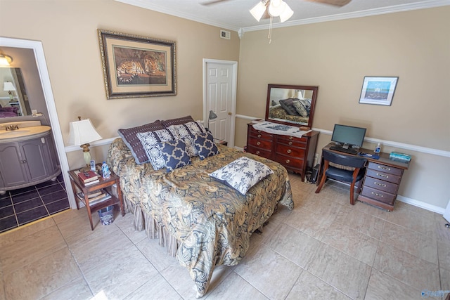 bedroom with crown molding, light tile patterned floors, ensuite bath, ceiling fan, and sink