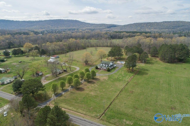 aerial view featuring a rural view, a mountain view, and a wooded view