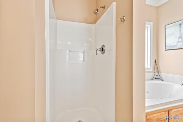 full bath with a tub with jets and walk in shower