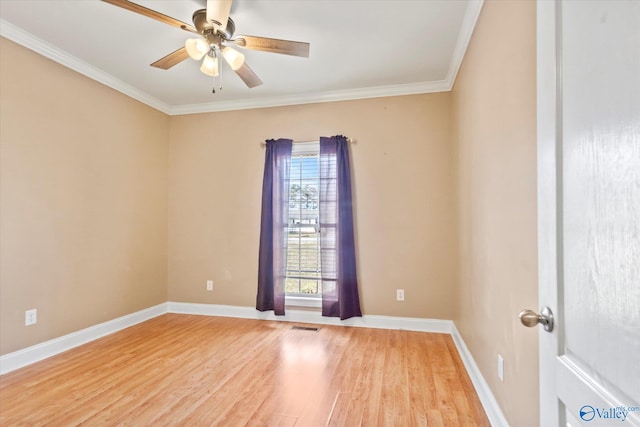 unfurnished room with ceiling fan, ornamental molding, light wood-type flooring, and baseboards