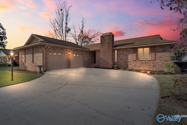 view of front of house with central AC and a garage