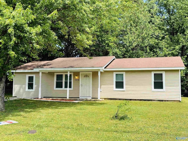ranch-style house with a front yard, covered porch, and crawl space