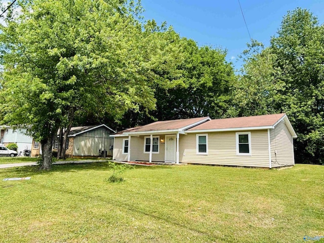ranch-style home with a front yard and a porch