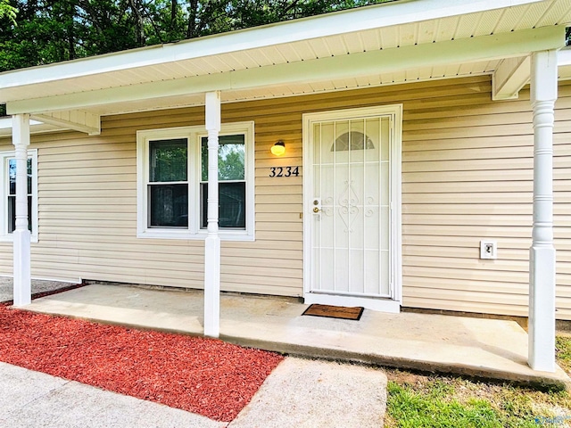 entrance to property with covered porch