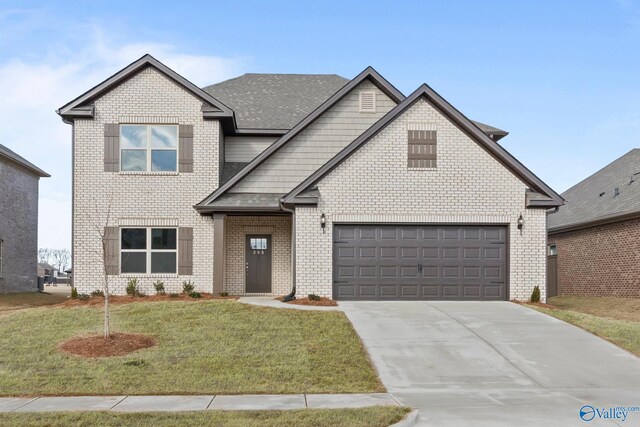 view of front of property featuring brick siding, driveway, and a front yard