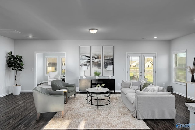 living area with baseboards, dark wood-style floors, and recessed lighting