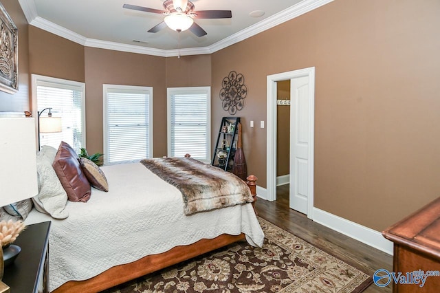 bedroom with visible vents, baseboards, ornamental molding, ceiling fan, and dark wood-type flooring