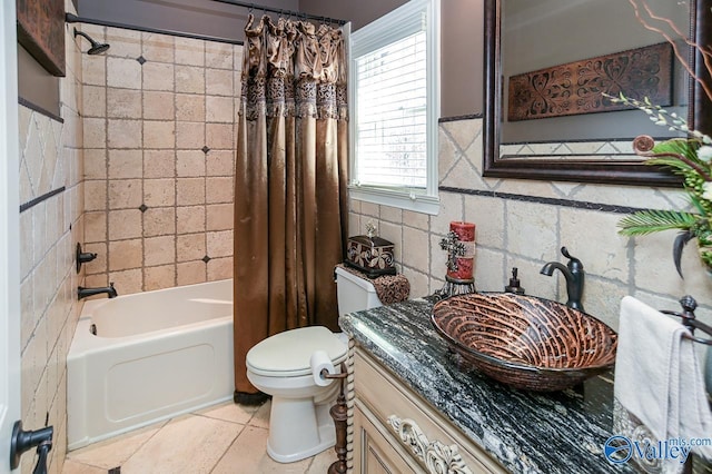full bathroom featuring tile walls, shower / bathtub combination with curtain, toilet, and vanity