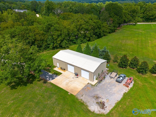 bird's eye view featuring a wooded view