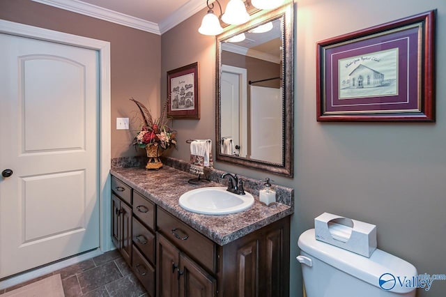 bathroom with crown molding, toilet, and vanity