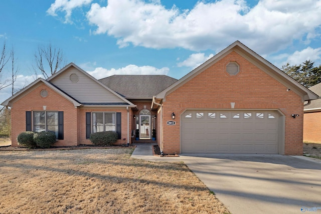 view of front of home with brick siding, concrete driveway, and an attached garage