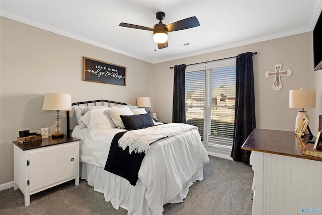 bedroom with a ceiling fan, visible vents, carpet floors, and ornamental molding