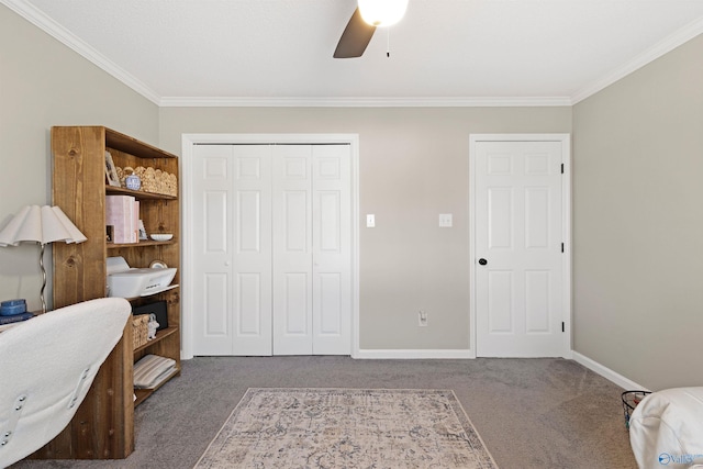 carpeted office with baseboards, ceiling fan, and crown molding