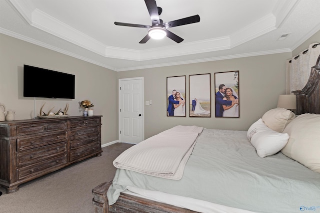 bedroom with visible vents, carpet floors, crown molding, a raised ceiling, and ceiling fan