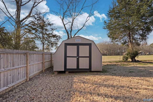 view of shed with a fenced backyard