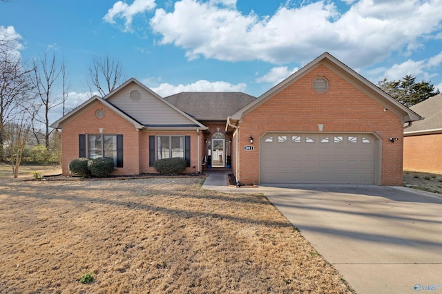 ranch-style house featuring brick siding, an attached garage, and concrete driveway