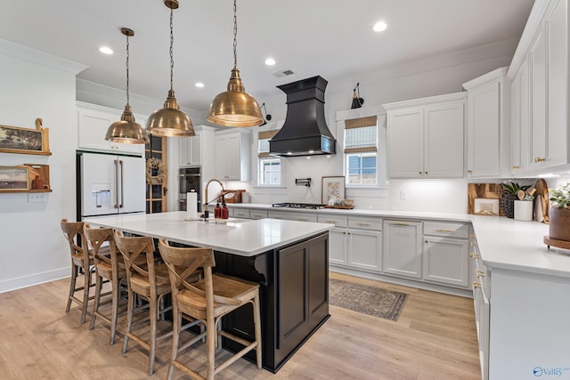 313 Merrydale Dr, Huntsville, AL 35811 - kitchen featuring custom exhaust hood, high end fridge, light countertops, tasteful backsplash, and recessed lighting