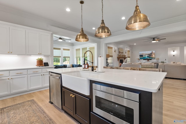 313 Merrydale Dr, Huntsville, AL 35811 - kitchen with ceiling fan, open floor plan, stainless steel appliances, light countertops, and recessed lighting